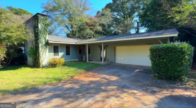 ranch-style home featuring a garage and a front lawn