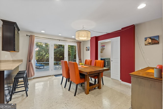 dining area with a notable chandelier