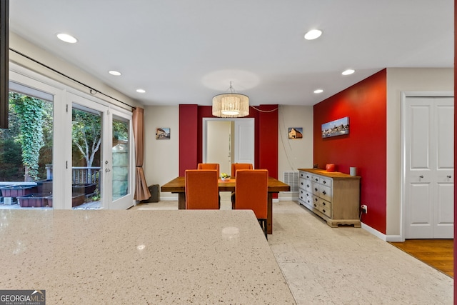 dining area featuring french doors and light hardwood / wood-style flooring