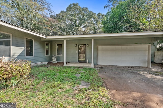 single story home with a garage and a porch