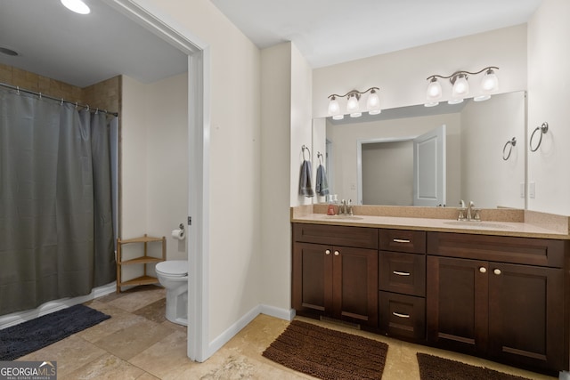 bathroom with toilet, curtained shower, and vanity