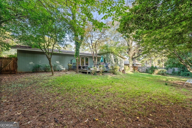 view of yard with a deck