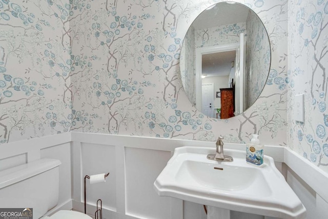 bathroom with sink and toilet