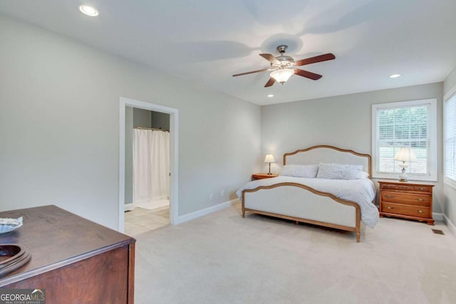 carpeted bedroom featuring ceiling fan and connected bathroom