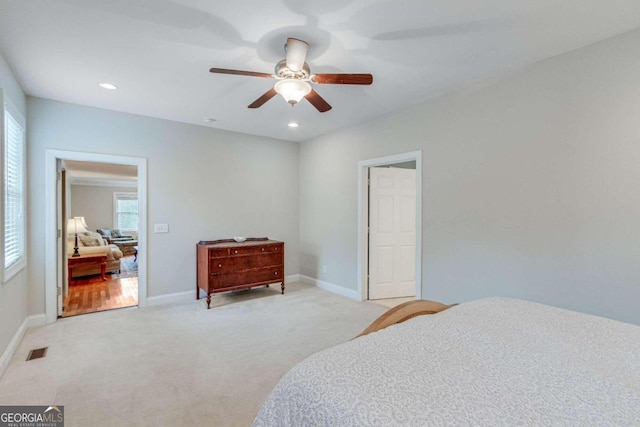 carpeted bedroom with ceiling fan