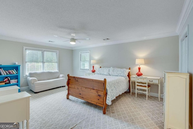 bedroom featuring ceiling fan, a textured ceiling, and crown molding