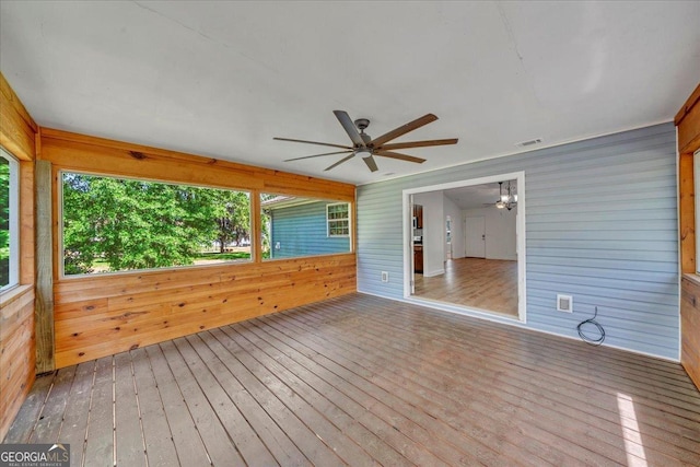 unfurnished sunroom featuring visible vents