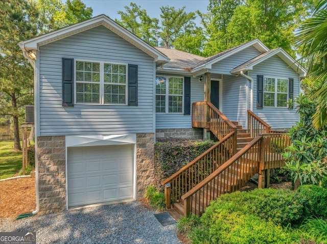 ranch-style home featuring an attached garage and driveway
