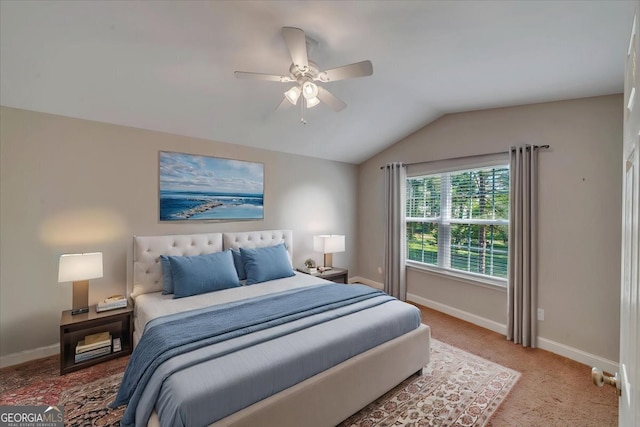 bedroom with vaulted ceiling, baseboards, carpet floors, and ceiling fan
