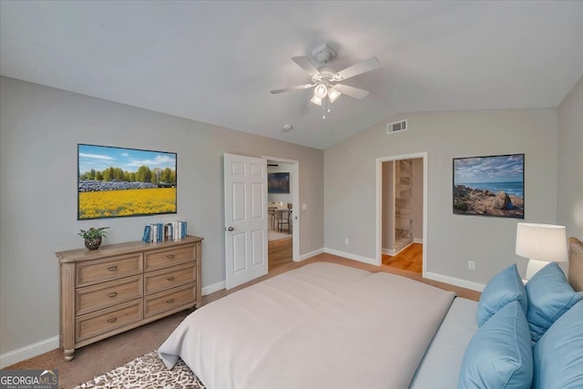 bedroom with lofted ceiling, a ceiling fan, visible vents, and baseboards