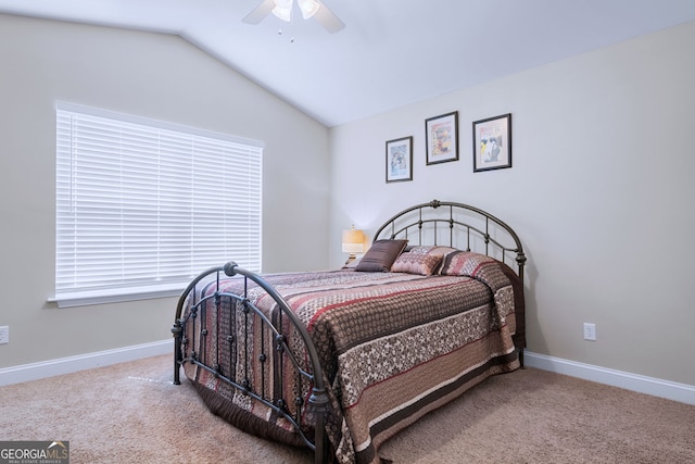 bedroom with carpet floors, vaulted ceiling, and ceiling fan