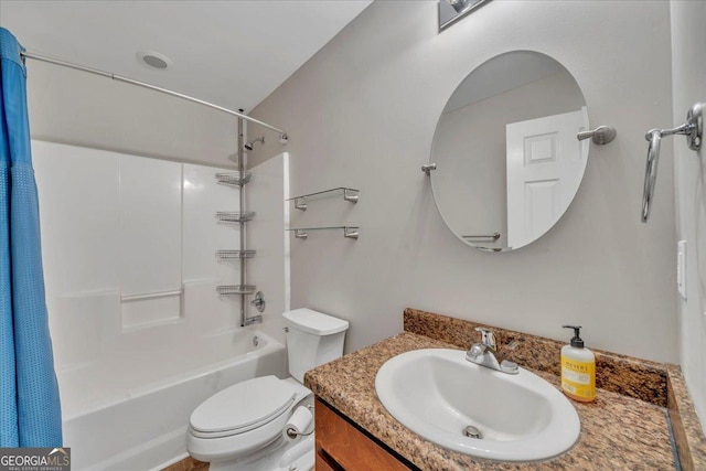 full bathroom featuring washtub / shower combination, toilet, and vanity
