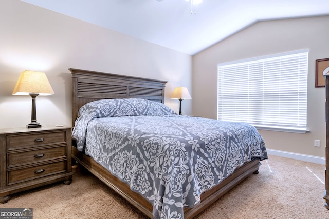 carpeted bedroom featuring vaulted ceiling