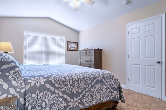 bedroom with vaulted ceiling, carpet, and ceiling fan