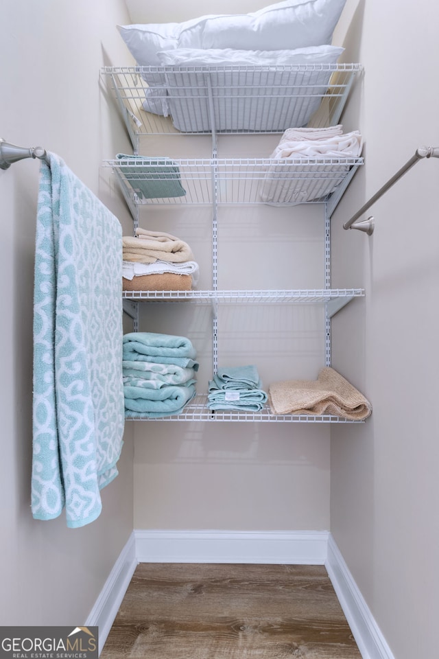 walk in closet featuring hardwood / wood-style floors