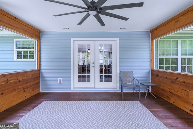 sunroom / solarium featuring french doors and ceiling fan