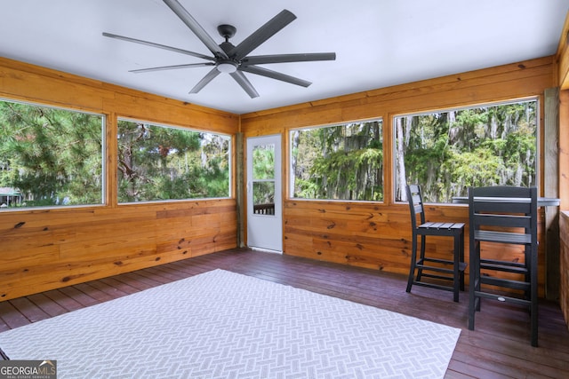 sunroom with ceiling fan and plenty of natural light