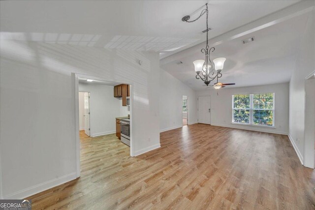 123 E Entreken Rd, Cobb, GA 31735 - unfurnished living room with lofted ceiling with beams, baseboards, a ceiling fan, and light wood-style floors