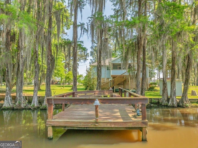 view of dock featuring a water view and stairway