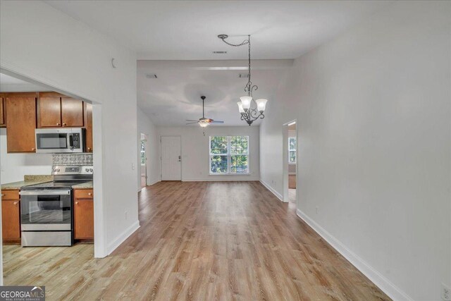 123 E Entreken Rd, Cobb, GA 31735 - dining space featuring lofted ceiling with beams, baseboards, visible vents, a chandelier, and wood finished floors