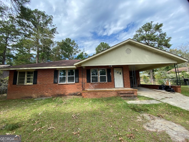 ranch-style home with a carport and a front lawn