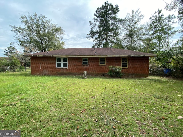 back of house with a yard