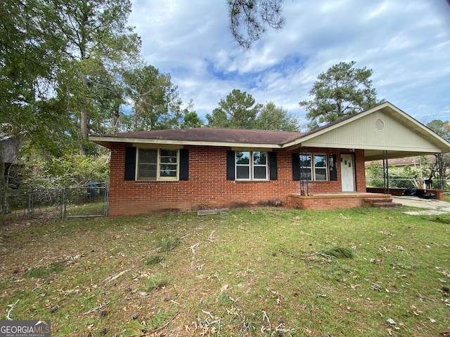 ranch-style house with a carport and a front lawn