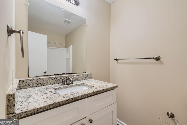 bathroom with vanity and visible vents