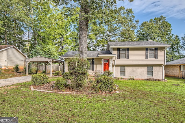 tri-level home with a gazebo and a front yard