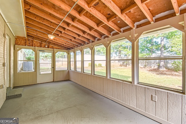 unfurnished sunroom with lofted ceiling and a healthy amount of sunlight