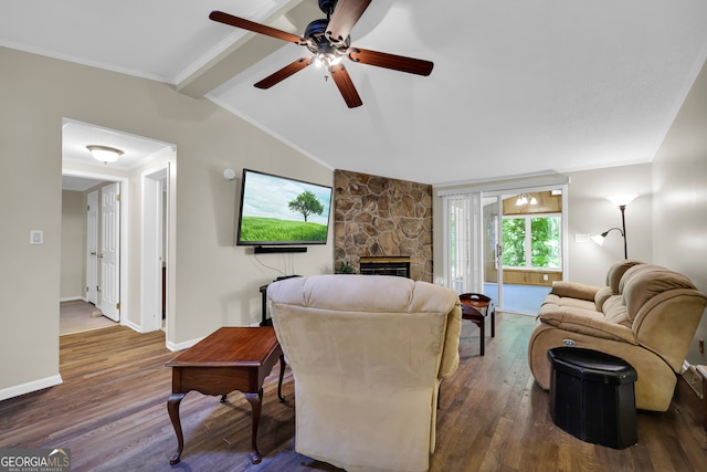 living room featuring ceiling fan, ornamental molding, lofted ceiling with beams, dark hardwood / wood-style floors, and a fireplace