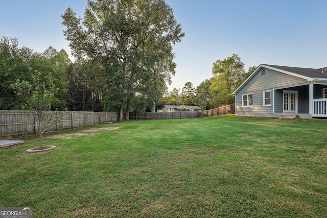 view of yard with a fenced backyard