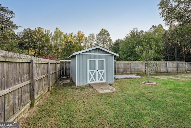 view of shed featuring a fenced backyard