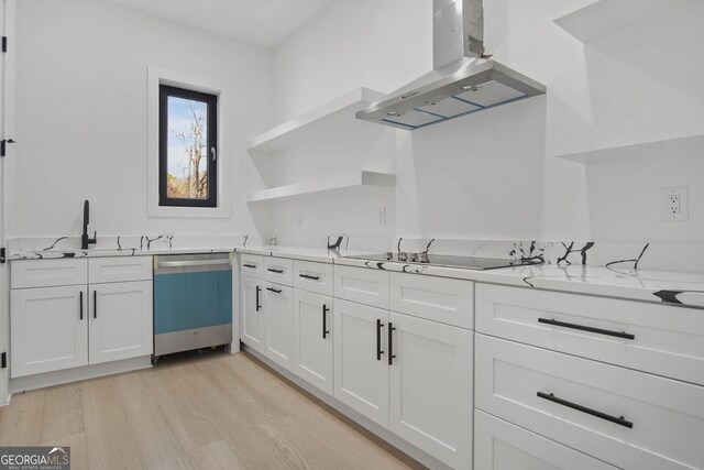 kitchen featuring white cabinetry, island range hood, black electric cooktop, dishwasher, and light stone countertops