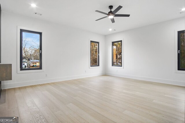 unfurnished room with ceiling fan and light hardwood / wood-style flooring