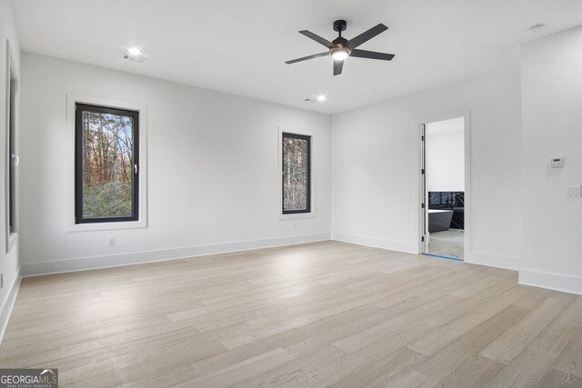 unfurnished room featuring ceiling fan and light hardwood / wood-style floors