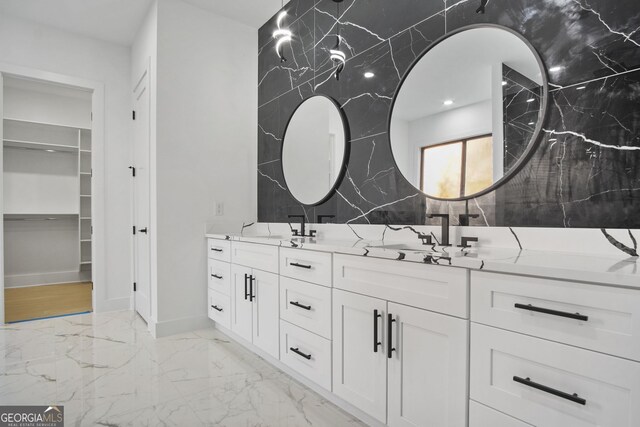 bathroom featuring tile walls and vanity