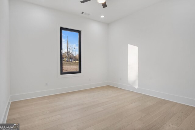 unfurnished room with ceiling fan and light hardwood / wood-style flooring