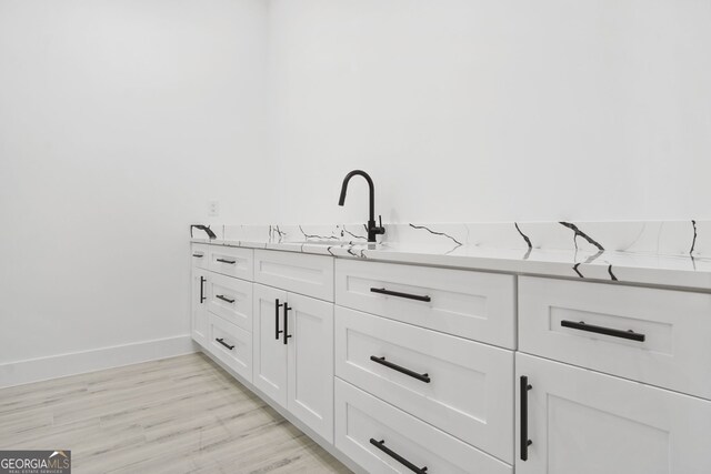 bathroom featuring hardwood / wood-style flooring and sink