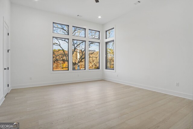 unfurnished room featuring light hardwood / wood-style flooring