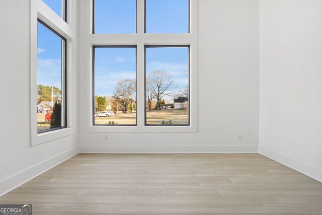 empty room with light wood-type flooring