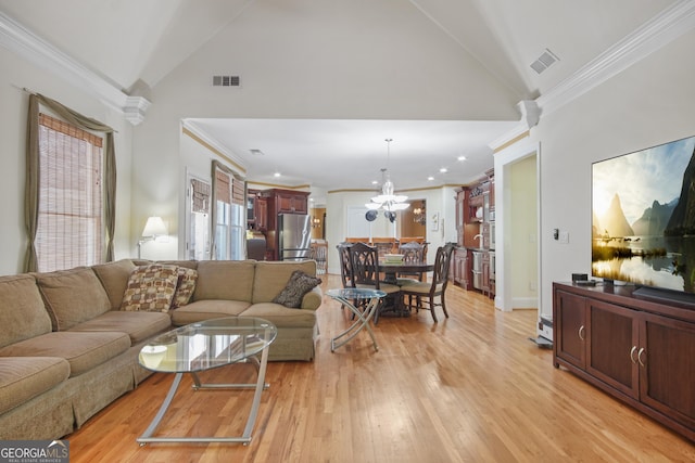 1565 Mountain Shadow Trl, Stone Mountain, GA 30087 - living area featuring light wood-style flooring, visible vents, a notable chandelier, and crown molding