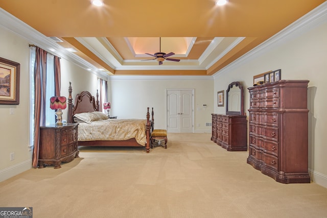 bedroom with light carpet, crown molding, ceiling fan, and a raised ceiling