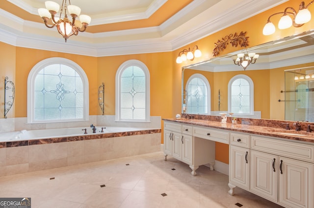 bathroom with crown molding, a tray ceiling, and vanity