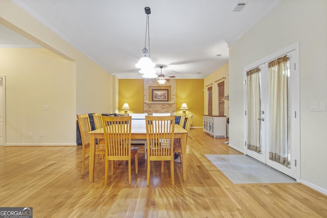 1565 Mountain Shadow Trl, Stone Mountain, GA 30087 - dining space featuring light wood-style floors, visible vents, and crown molding