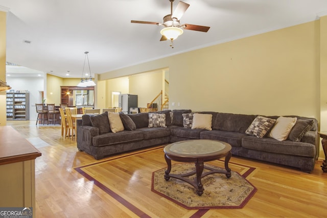 1565 Mountain Shadow Trl, Stone Mountain, GA 30087 - living area with light wood-style floors, crown molding, stairs, and ceiling fan