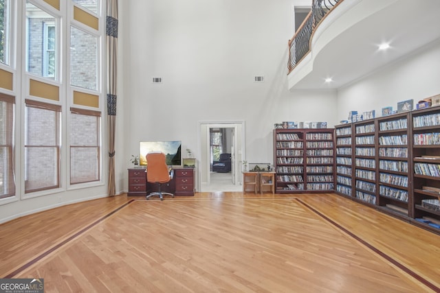 1565 Mountain Shadow Trl, Stone Mountain, GA 30087 - interior space featuring wood finished floors, a towering ceiling, and visible vents