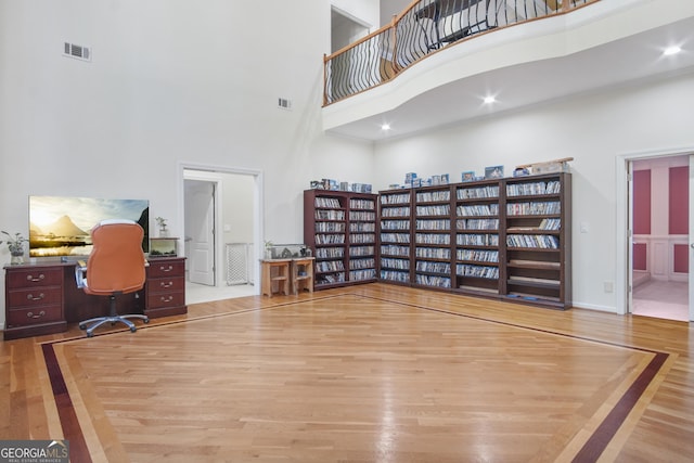 1565 Mountain Shadow Trl, Stone Mountain, GA 30087 - office space with a high ceiling, wood finished floors, and visible vents