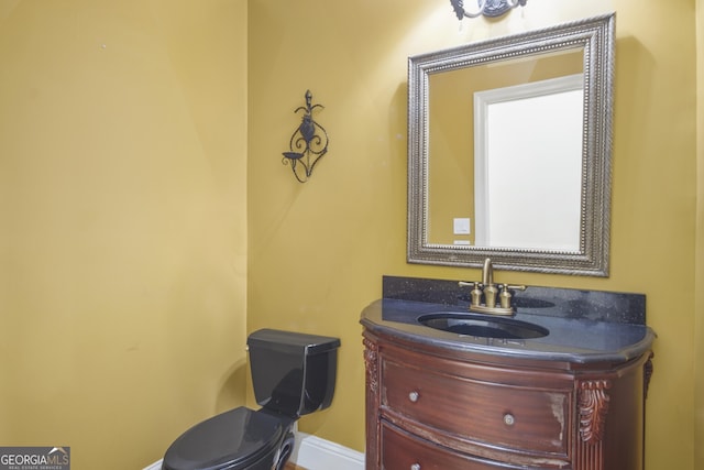 1565 Mountain Shadow Trl, Stone Mountain, GA 30087 - bathroom featuring toilet, vanity, and baseboards