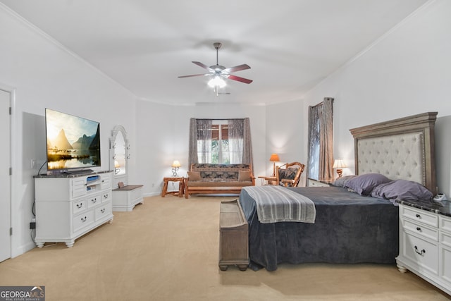 carpeted bedroom featuring ceiling fan and ornamental molding